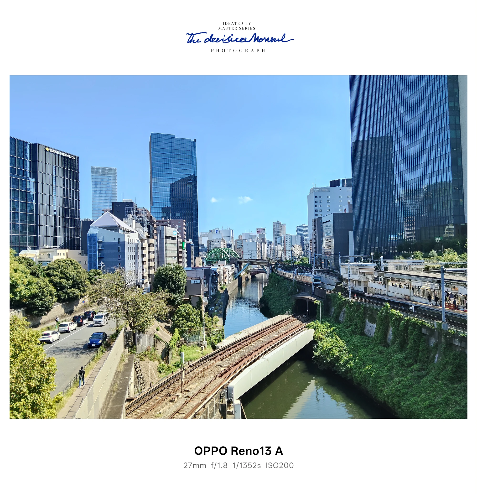 OPPO Reno13 A 広角作例：都心の川沿いと鉄道橋、ビル群を一望する風景