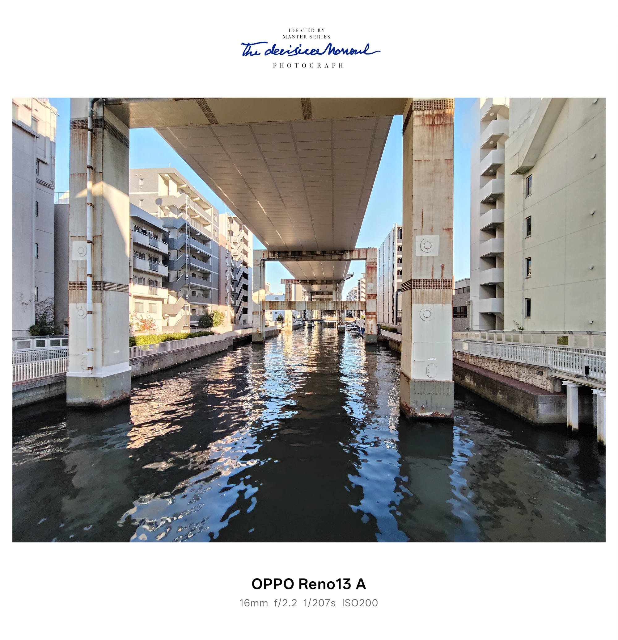 OPPO Reno13 Aの超広角で撮影した高架下の運河（建物と水面の反射）