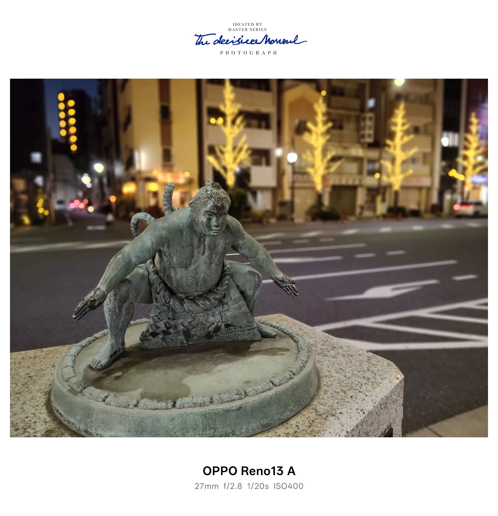 夜の街並みを背景に相撲力士像（構え）を撮影したOPPO Reno13 Aカメラ作例
