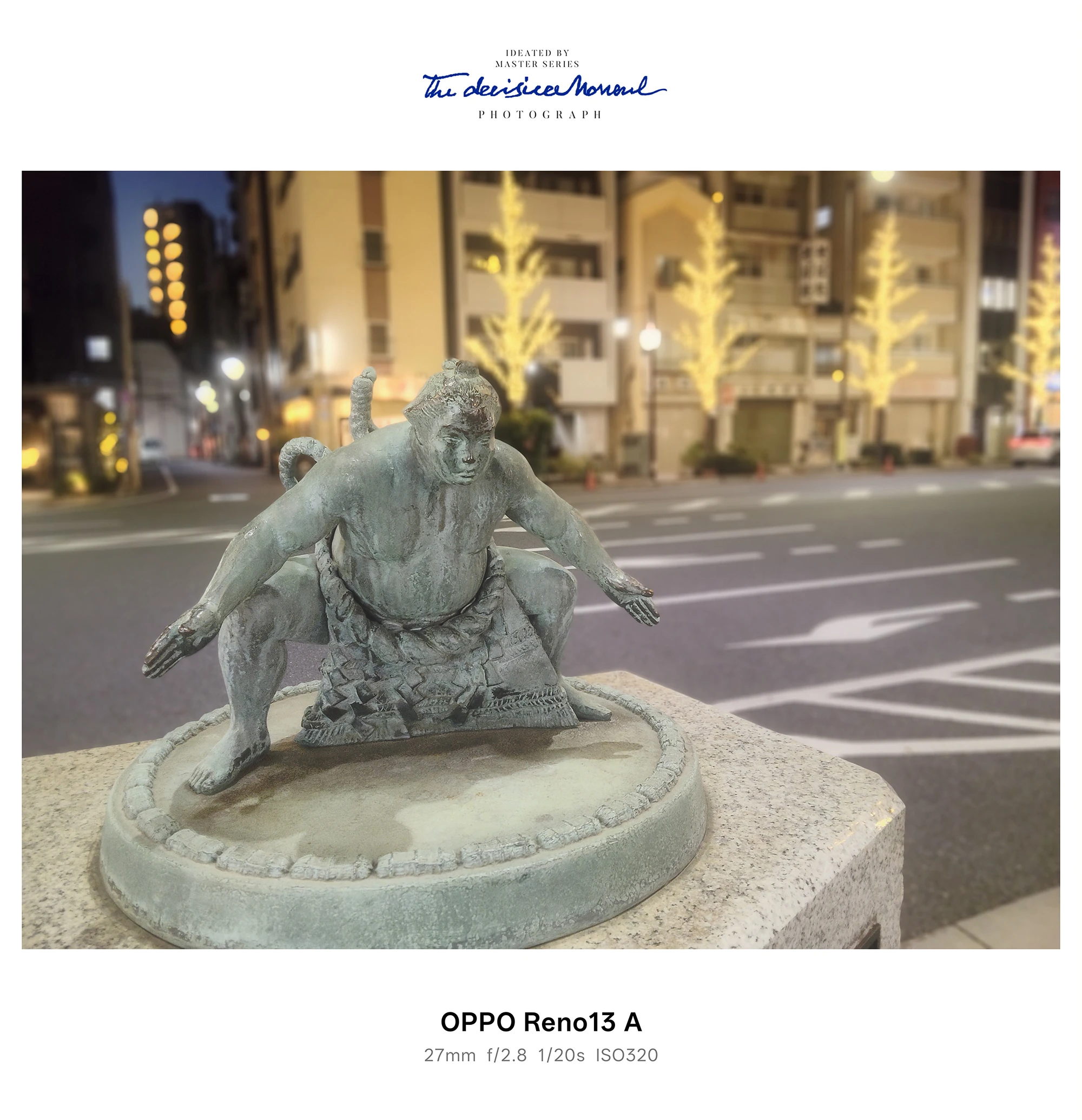 夜景の街並みを背景に構える力士像を撮影したOPPO Reno13 A作例（ISO320）
