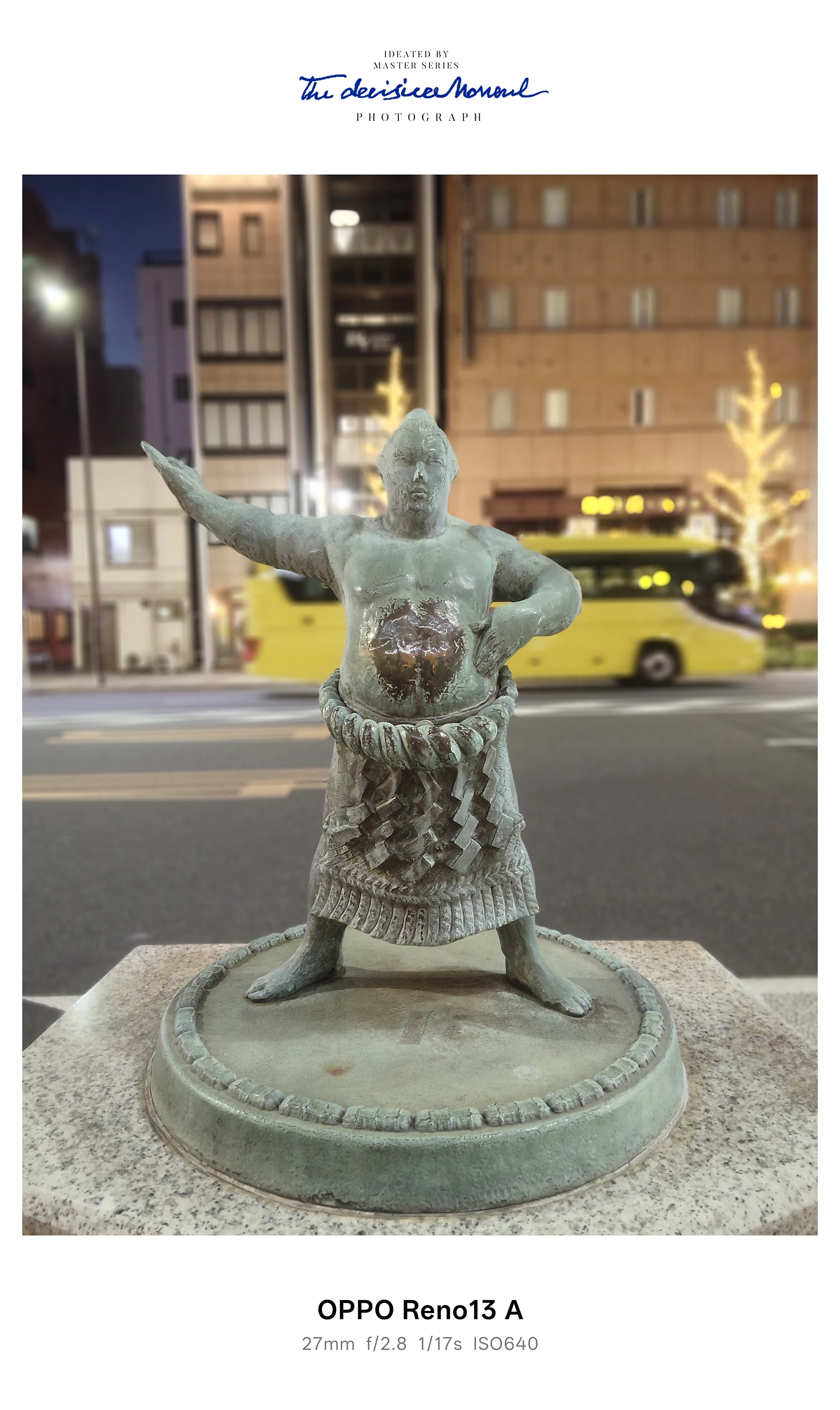 夜景の街並みを背景に構える力士像を撮影したOPPO Reno13 A作例（ISO320）